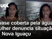 Mulher quase coberta pela água denuncia enchente em Nova Iguaçu no RJ; veja