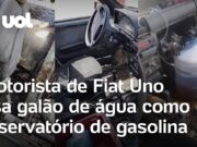 Motorista é flagrado em Fiat Uno caindo aos pedaços e com galão de água como tanque; veja