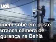 Homem é flagrado subindo em poste e arrancando câmera de segurança na Bahia; veja