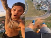 Homem sobe em torre e fica pendurado com uma mão só no DF; veja