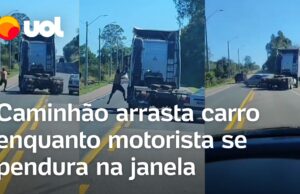 Homem se pendura na janela para agredir motorista enquanto caminhão arrasta carro; veja